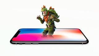En fotoillustration av en Fortnite: Battle Royale-karaktär i en dino-kostym som kommer från en iPhone X.